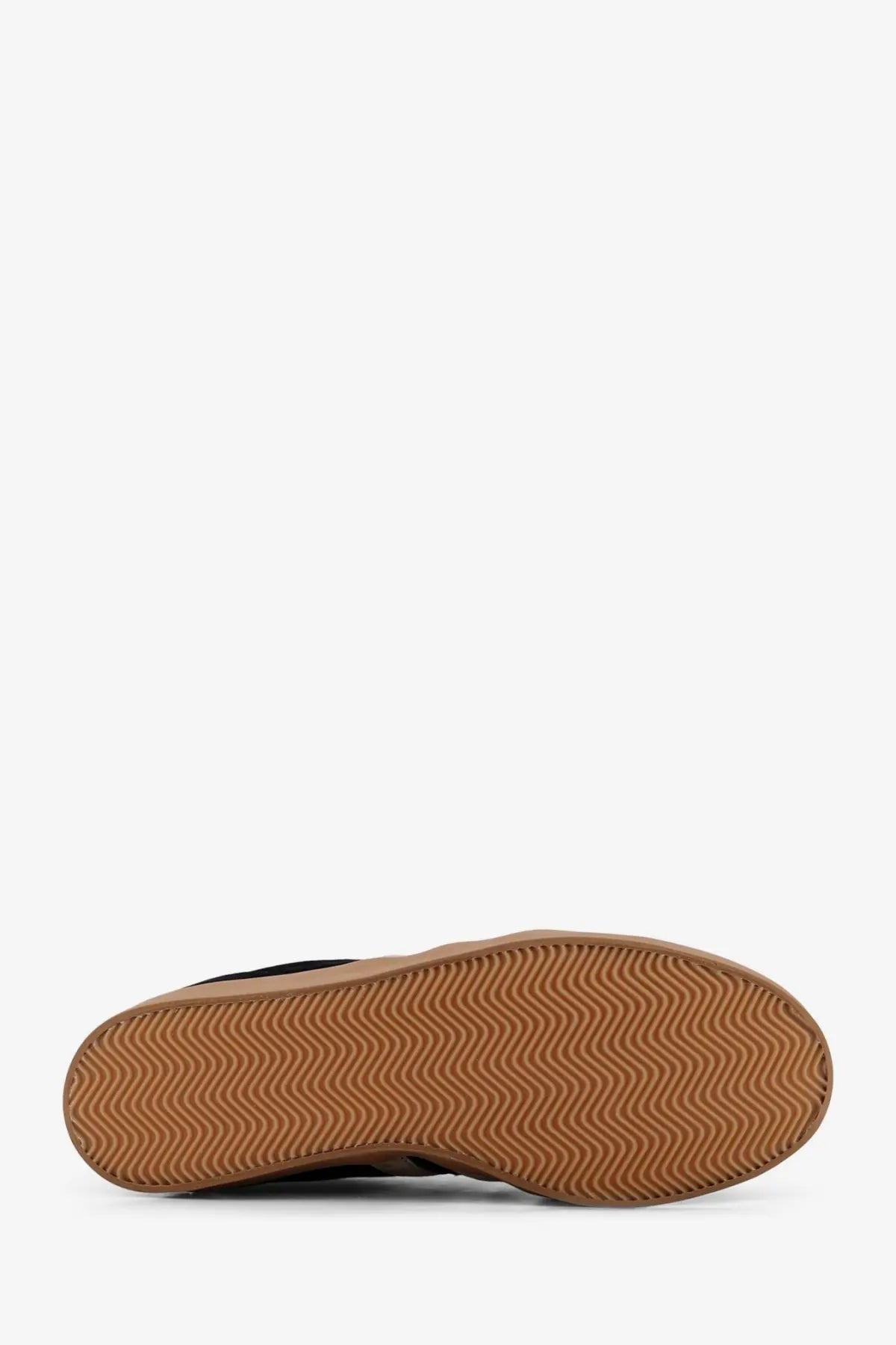 Tan rubber sole with wavy tread pattern on y-3 men’s gazelle suede sneakers black