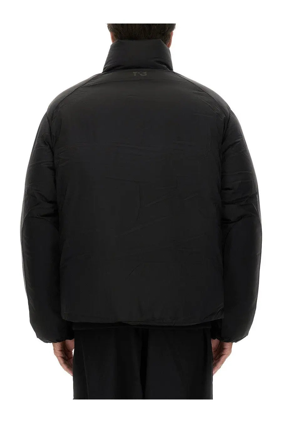 Black y-3 men’s padded jacket with high collar and subtle branding at the neckline for cold weather wear