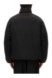 Black y-3 men’s padded jacket with high collar and subtle branding at the neckline for cold weather wear