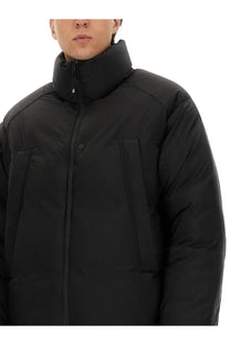 Black y-3 men’s padded jacket with high collar front zipper closure and puffer insulation for cold weather wear