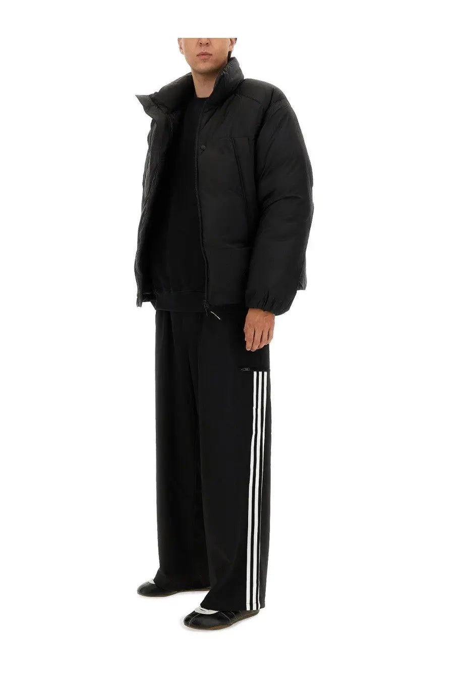 Y-3 men’s black padded jacket with quilted design and high collar for warmth and style