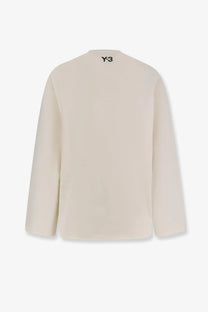 Cream-colored y-3 men’s re 3s ls cotton sweater with minimalist design and black logo at neckline