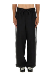 Black adidas y-3 men’s sport uniform stripes track pants with white three stripes and drawstring waistband