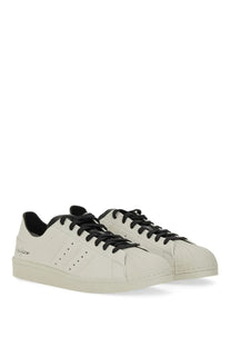 Y-3 men’s superstar sneaker white cream-colored leather with black laces and adidas three-stripe design