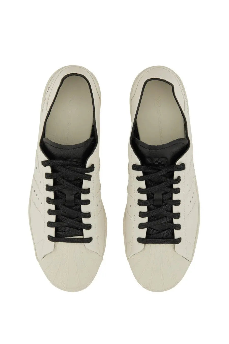 White leather y-3 men’s superstar sneaker with black laces and tongue in a classic low-top design