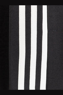 Y-3 men’s wire pants in black recycled polyester with three bold white stripes running vertically along the side