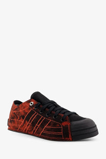 Y-3 women’s nizza lo canvas sneakers black featuring red and black camouflage with bold red stitching on three stripes