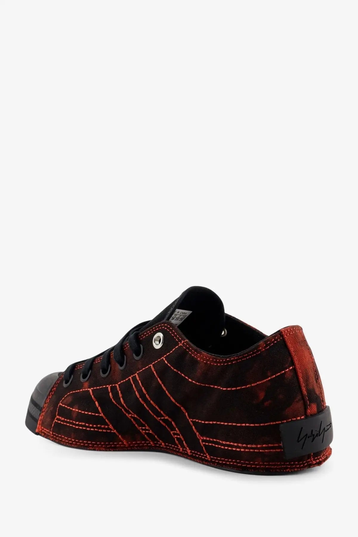 Back view of y-3 women’s nizza lo canvas sneakers black with red and black suede and bold red stitching