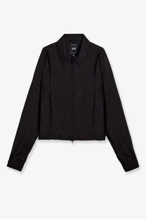 Black y-3 women’s nylon zip-up jacket with sleek minimalist design and subtle collar branding