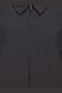 Y-3 women’s black nylon zip-up jacket with structured collar and sleek minimalist design