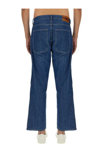Ymc men’s jeans bez blue showing blue denim fabric with brown leather brand patch at the waistband back view