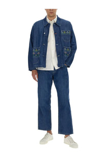 YMC men’s blue denim jacket with floral embroidery on front pockets made from durable jeans fabric