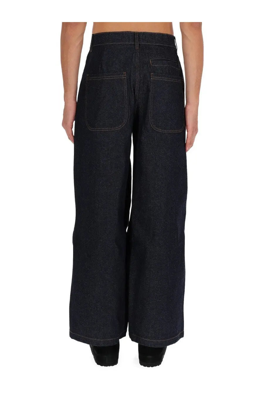 Back view of ymc men’s replacement jeans in dark indigo denim with wide-leg fit and contrasting stitching