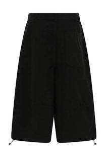YMC men’s black high-waisted wide-leg shorts with sleek minimalist design and drawstring hem front view