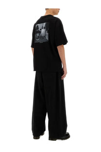 Black short-sleeved cotton t-shirt with black-and-white photographic print on the back by YMC Mens Triple JC FM Shirt Black