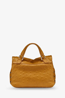 A mustard-yellow ostrich-embossed leather handbag with silver hardware and top handles for women by Zanellato