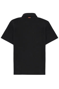 Zegna men’s regular fit black polo shirt with short sleeves and subtle orange tag at the collar