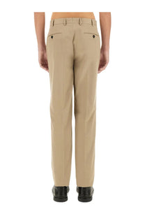 Beige khaki tailored zegna men’s straight leg dress pants shown from the back with buttoned rear pockets