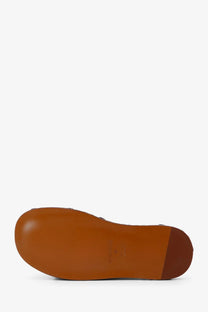 Brown leather sole of zimmermann women’s alchemy leather sandals siena with smooth finish and embossed branding near heel