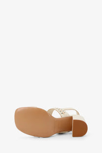 Zimmermann women’s alchemy leather sandal in cream with block heel and decorative star cutouts on the strap