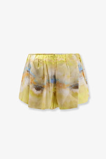 Zimmermann women’s alchemy silk micro shorts brown in yellow with soft pleats and abstract face print in muted tones
