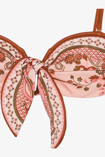 Zimmermann women’s aster shiny nylon bikini top in blue with pink and brown floral pattern and tied fabric bow detail