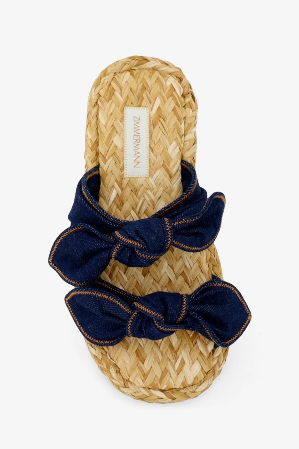 Navy blue denim bow sandals with woven straw sole featuring Zimmermann label for women