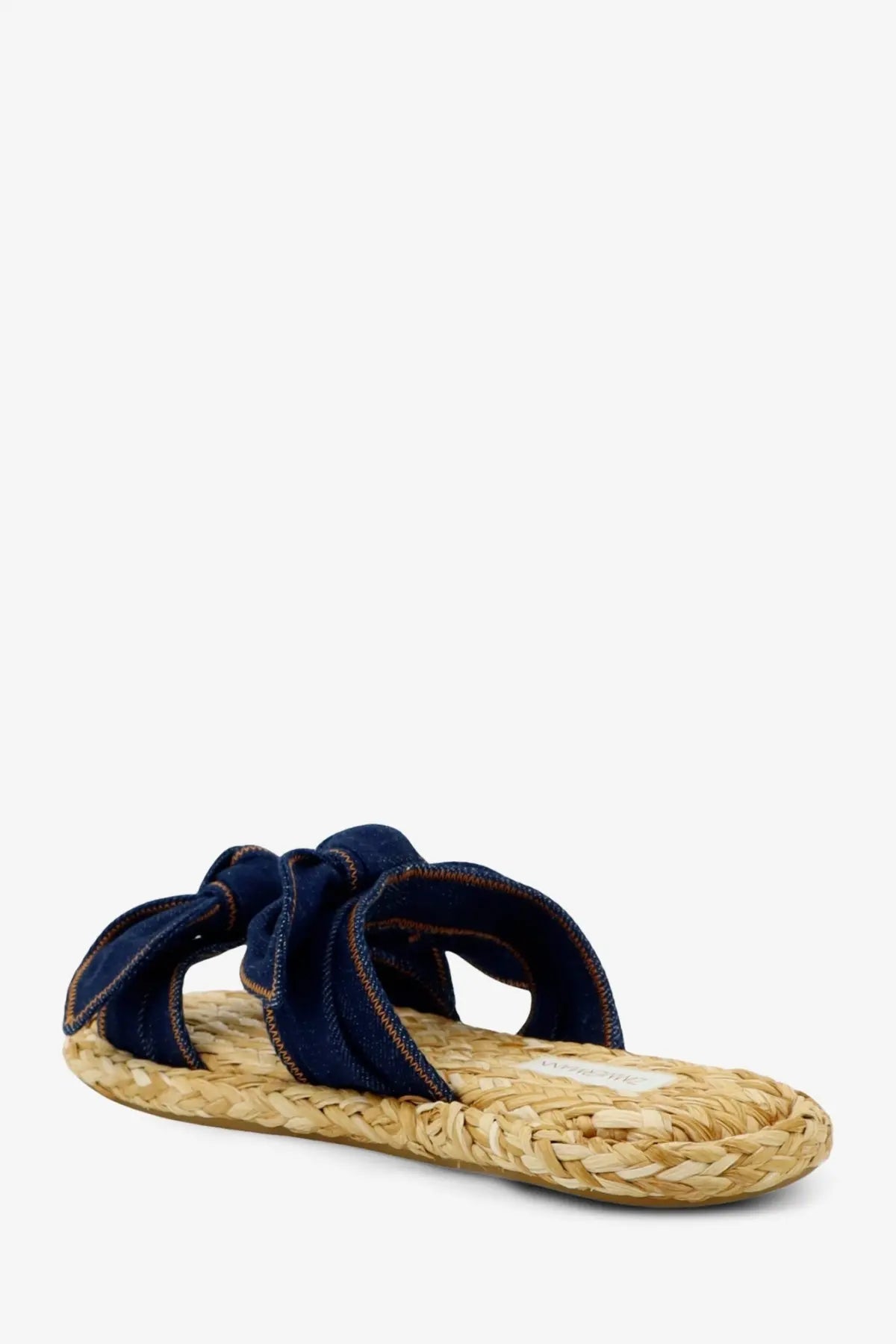 Navy blue denim bow slide sandal with woven straw sole from zimmermann womens carousel raffia and denim sandals blue