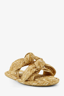Beige woven straw sandals with braided knot design across the foot by zimmermann women’s carousel raffia sandals white