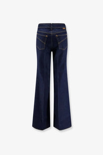Back view of Zimmermann women’s dark indigo cotton denim flare jeans with gold-tone stitching and classic pockets