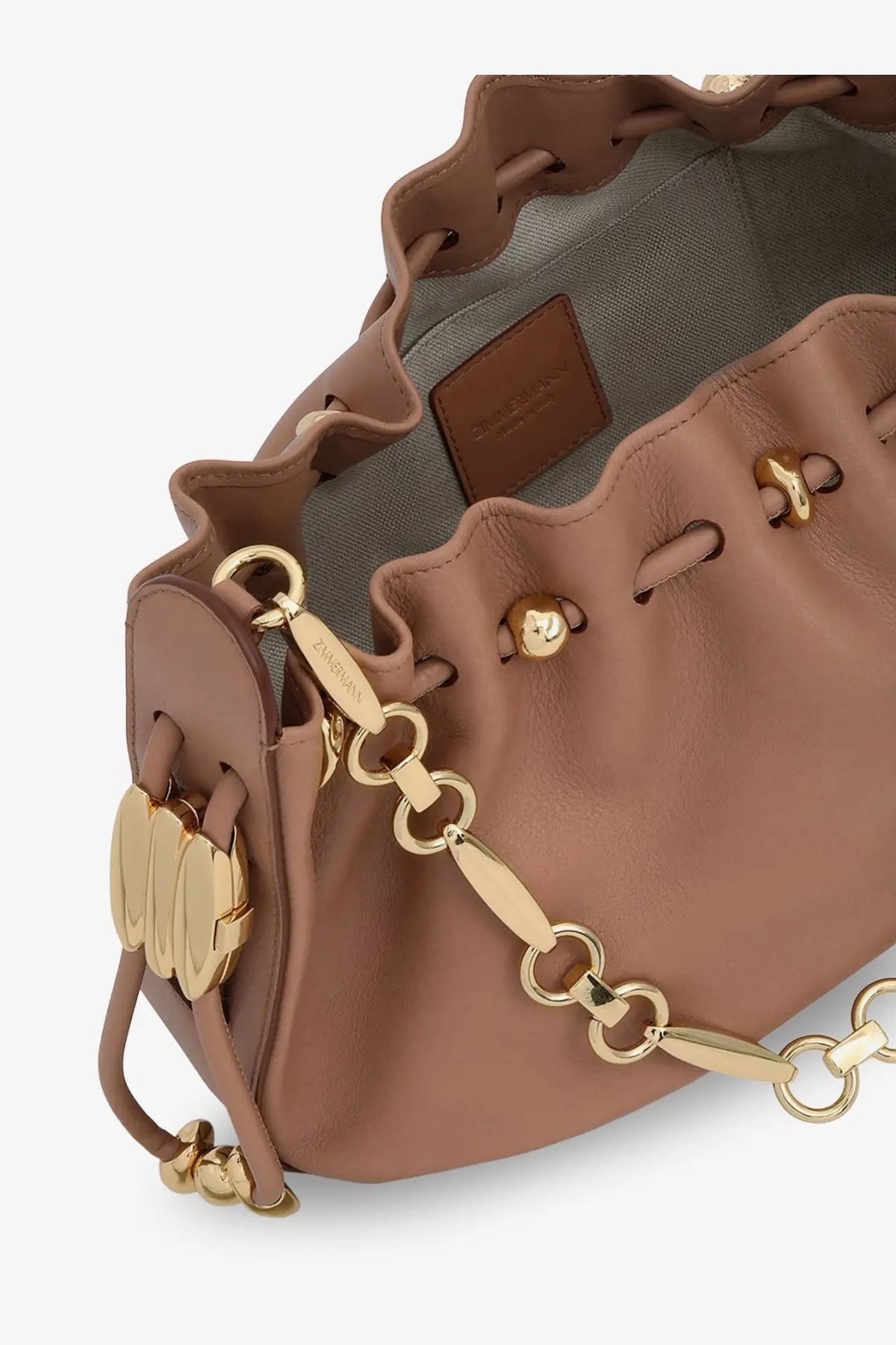 Zimmermann women’s halcyon leather clutch beige tan leather bucket bag with gold-tone hardware and chain strap
