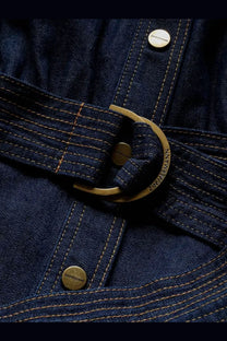 Zimmermann women’s long denim dress blue featuring a dark blue denim jacket with brass-colored buckle and buttons