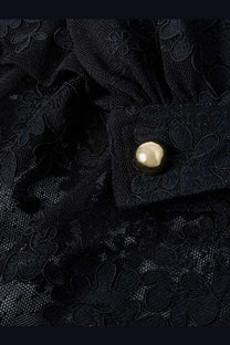 Zimmermann women’s luna lace harem pant black showing round metallic gold button on black floral lace fabric