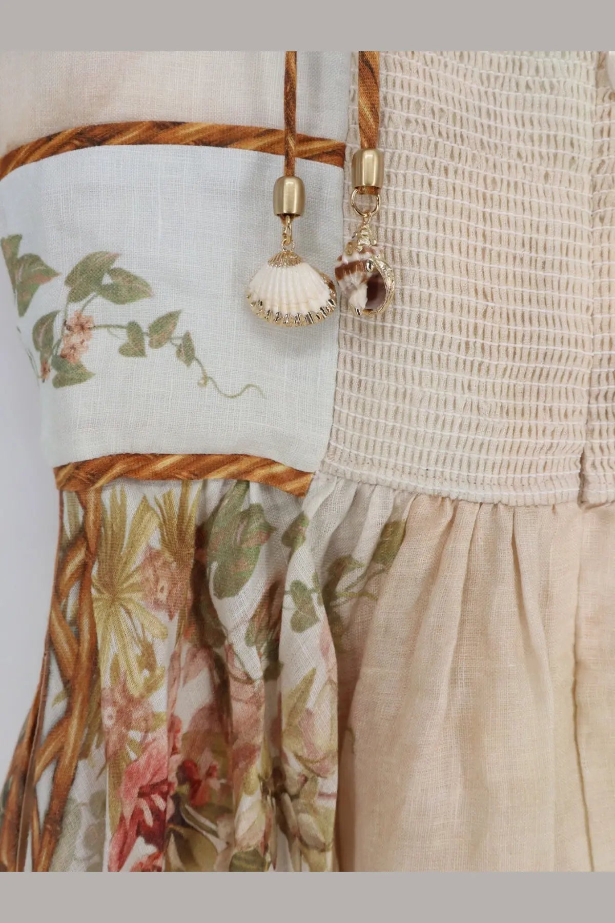 Zimmermann women’s Mahon linen dress in gold beige with floral pattern and woven rope trim for elegant wear