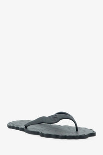 Zimmermann women’s seafoam black rubber thong sandals with scalloped edge and embossed bird design on the sole