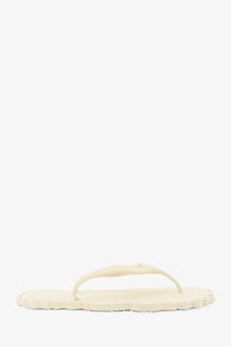 Zimmermann women’s seafoam white rubber thong sandals with cream-colored scalloped edge and simple strap